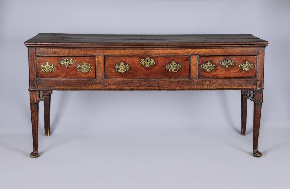 A GEORGIAN FRUITWOOD DRESSER BASE Image