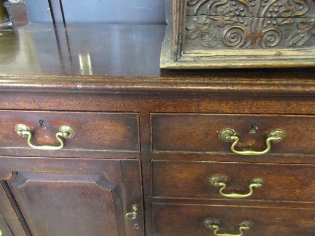 A GEORGIAN OAK ENCLOSED DRESSER Image