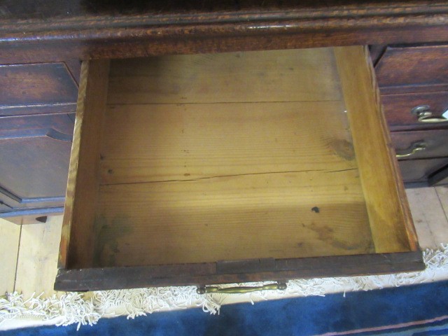 A GEORGIAN OAK ENCLOSED DRESSER Image