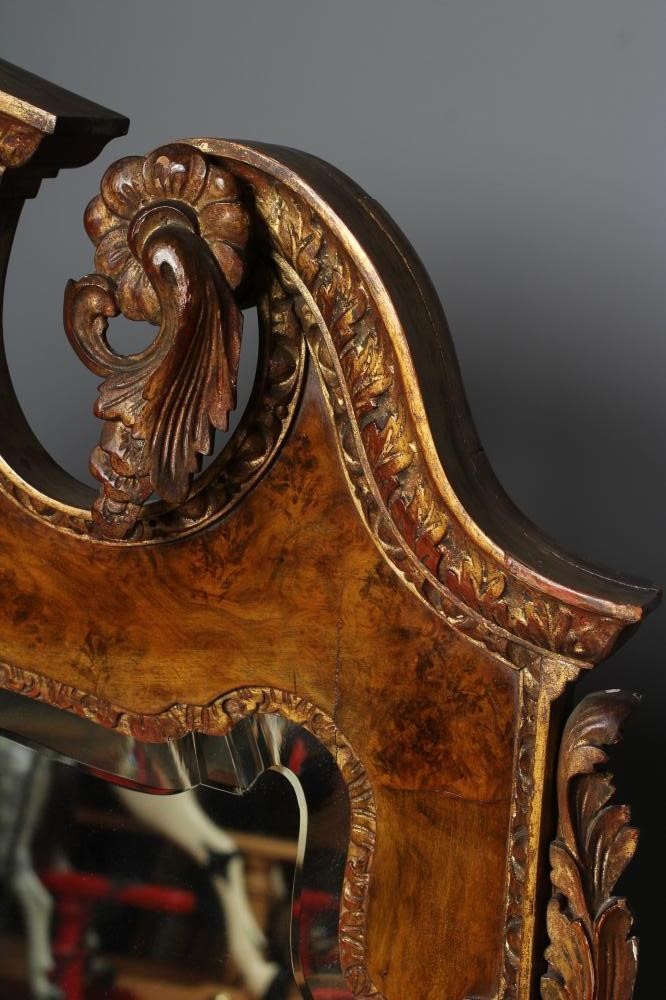 A WALNUT VENEERED AND PARCEL GILT PIER GLASS of early Georgian design Image