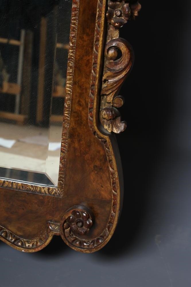 A WALNUT VENEERED AND PARCEL GILT PIER GLASS of early Georgian design Image