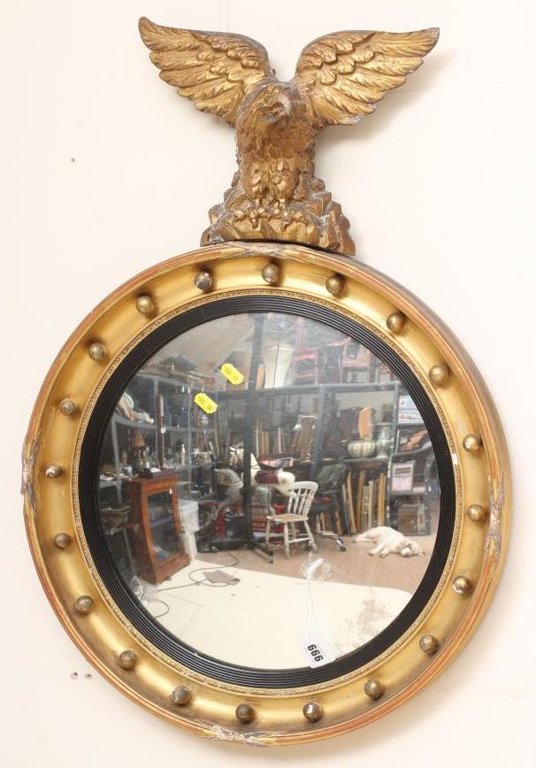 A GILT WOOD CONVEX WALL MIRROR Image