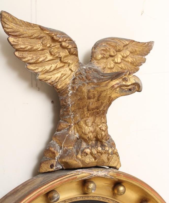 A GILT WOOD CONVEX WALL MIRROR Image