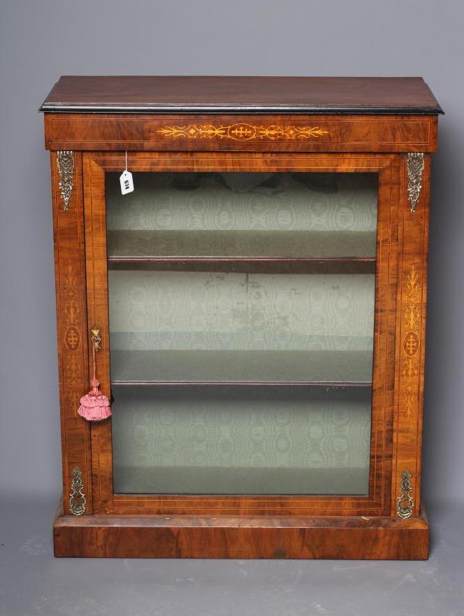 A VICTORIAN WALNUT PIER CABINET of shallow oblong form with ebony trim Image
