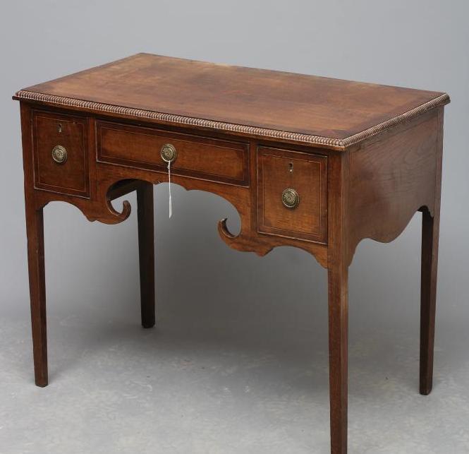AN OAK AND MAHOGANY LOW BOY Image