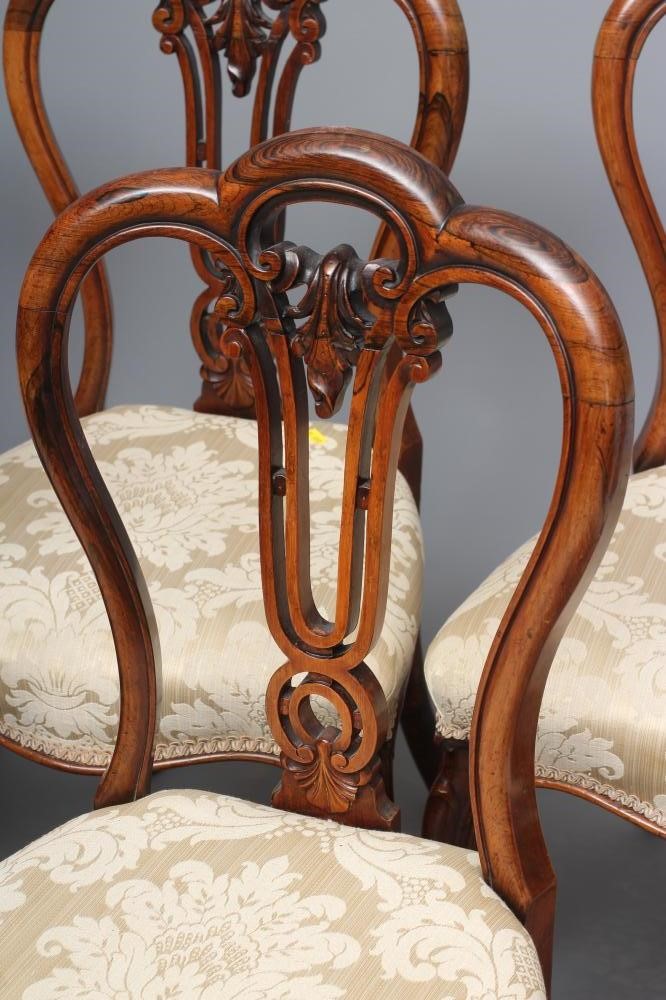 A SET OF SIX VICTORIAN ROSEWOOD DINING CHAIRS of balloon back form upholstered in cream silk damask Image