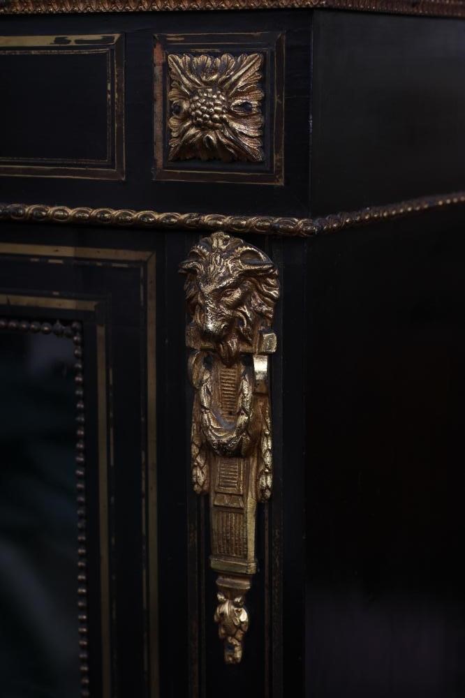 A VICTORIAN EBONISED AND BRASS INLAID PIER DISPLAY CABINET with gilt metal mounts and inset blue Image