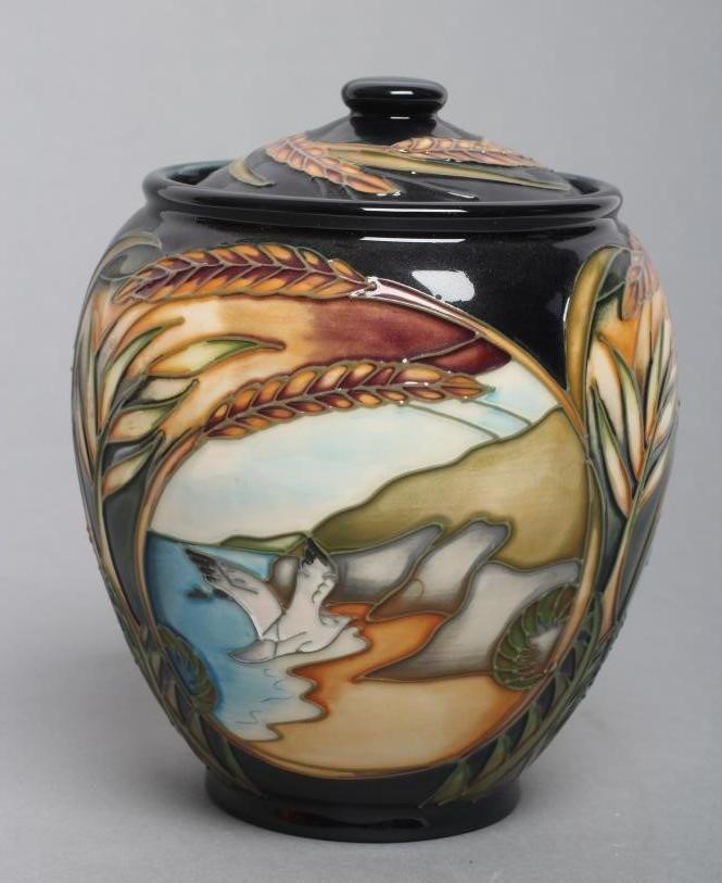 A MOORCROFT POTTERY "LANDSCAPE MEDLEY" PATTERN JAR AND COVER Image