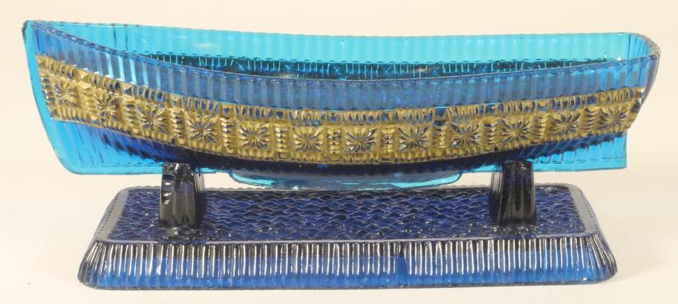 A VICTORIAN SOWERBY BLUE GLASS BOAT AND STAND Image