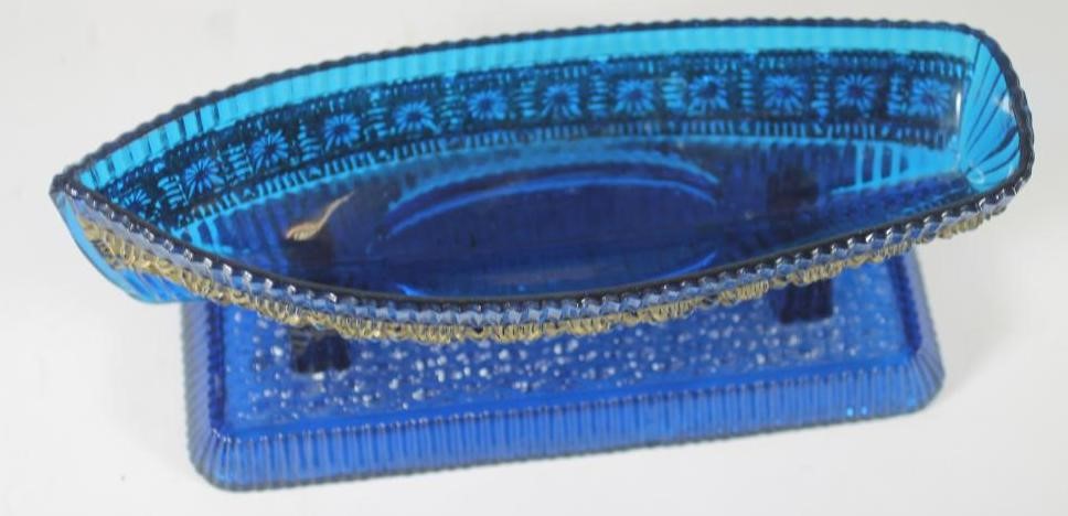 A VICTORIAN SOWERBY BLUE GLASS BOAT AND STAND Image