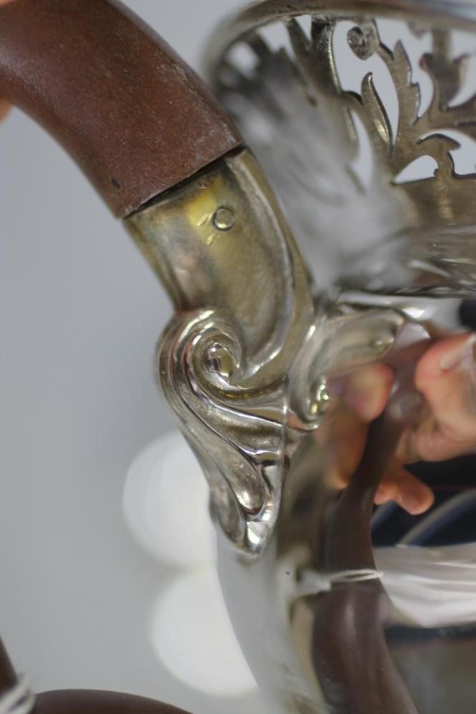 A COMPOSITE FOUR PIECE SILVER TEA AND COFFEE SERVICE Image