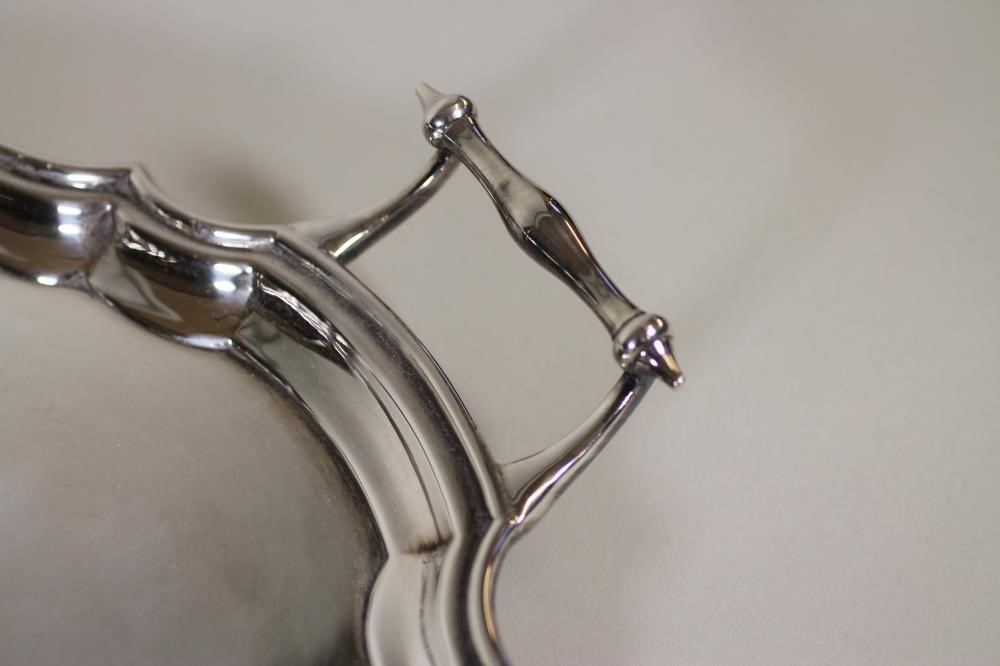 A SILVER TWO HANDLED TEA TRAY Image