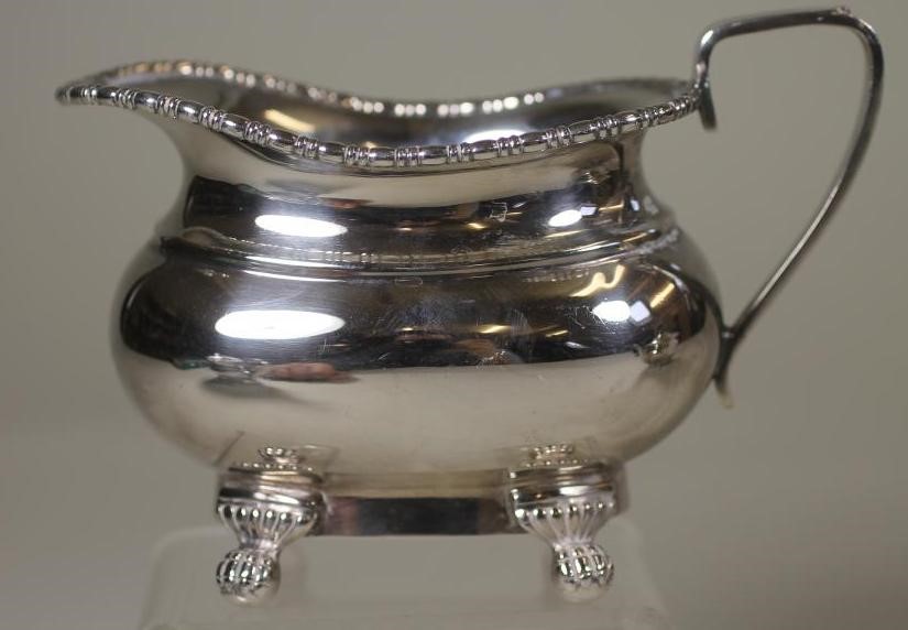 A THREE PIECE SILVER TEA SERVICE Image