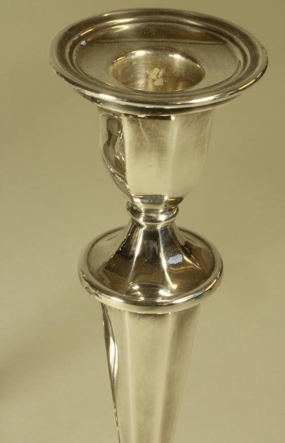 A SET OF FOUR SILVER CANDLESTICKS Image