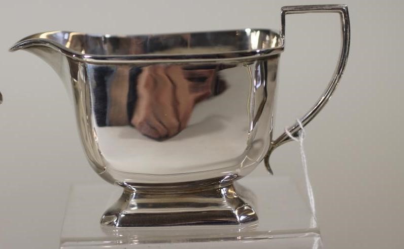 A COMPOSITE FOUR PIECE SILVER TEA SERVICE Image