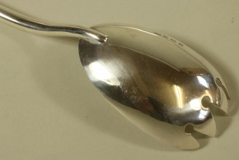 A PAIR OF SILVER SALAD SERVERS Image