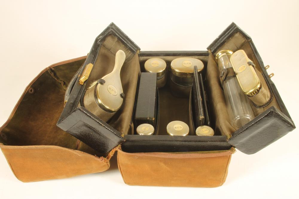 A GENTLEMAN'S SILVER TRAVELLING DRESSING CASE Image