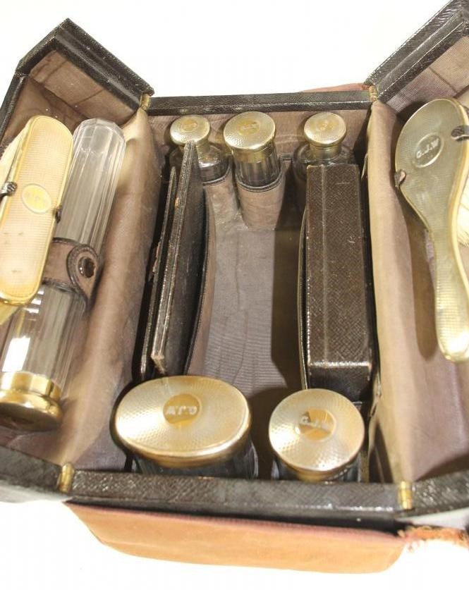 A GENTLEMAN'S SILVER TRAVELLING DRESSING CASE Image