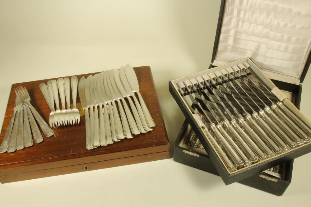 A SET OF TWELVE PAIRS OF ART DECO SILVER FISH KNIVES AND FORKS Image