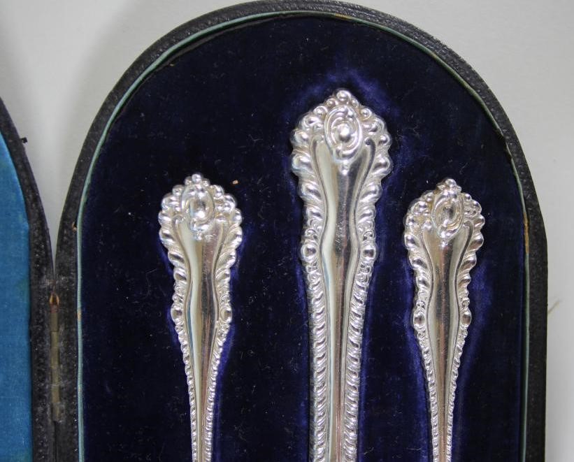 A LATE VICTORIAN COMPOSITE SILVER THREE PIECE CHRISTENING SET Image