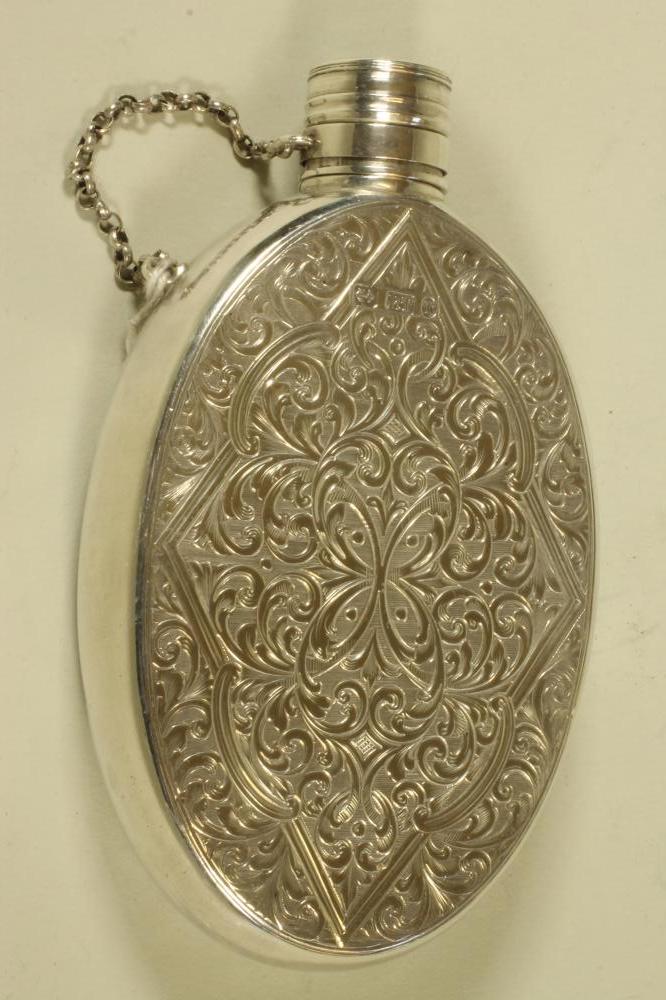 A MID VICTORIAN SILVER HIP FLASK Image
