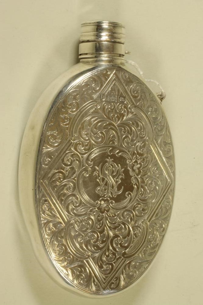A MID VICTORIAN SILVER HIP FLASK Image