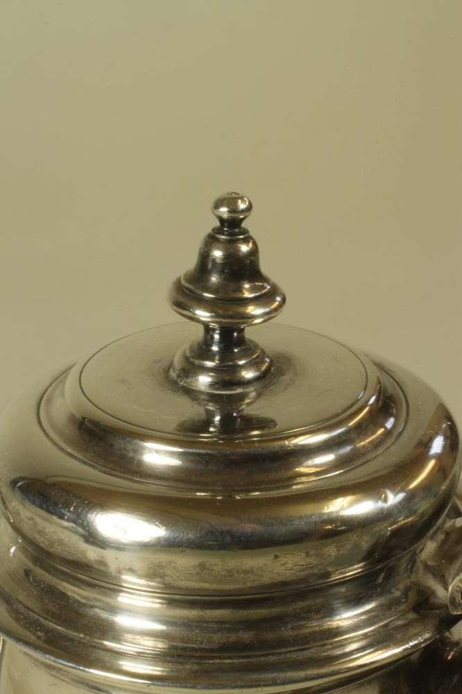 A GEORGE III SILVER COFFEE POT of tapering cylindrical form with hinged flat domed cover and urn Image
