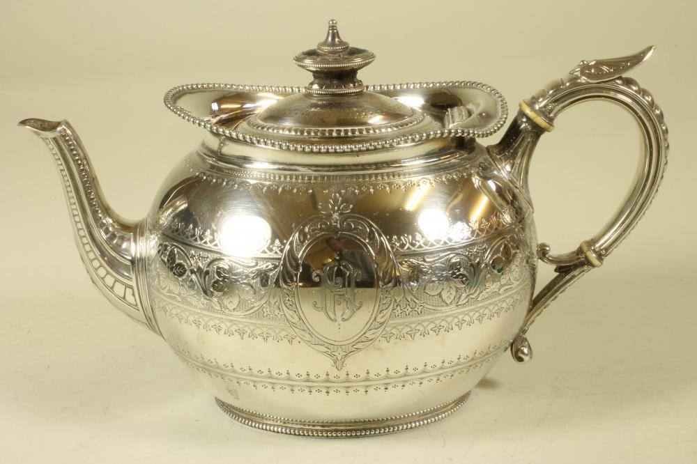 A VICTORIAN SILVER TEAPOT Image