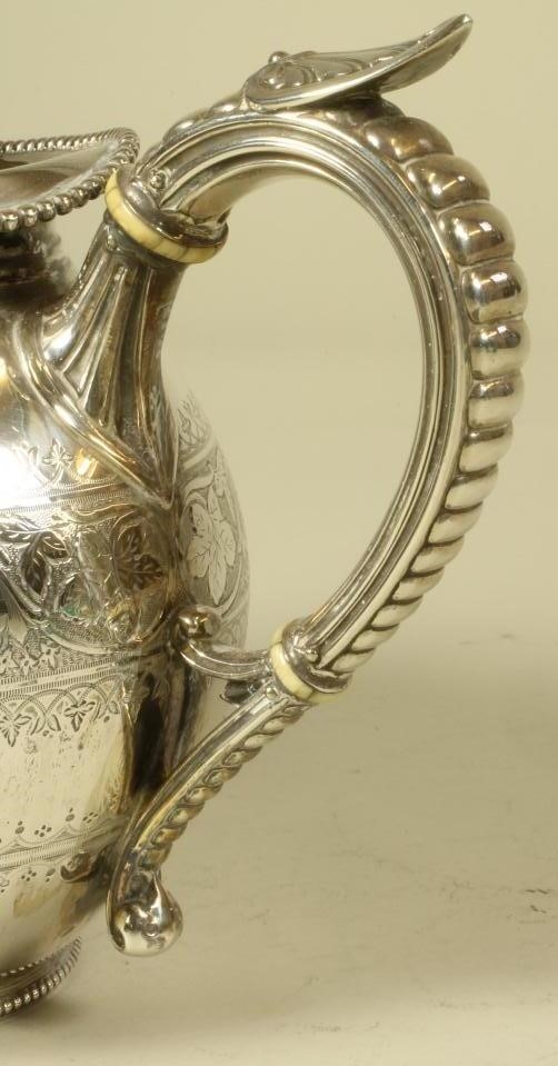 A VICTORIAN SILVER TEAPOT Image