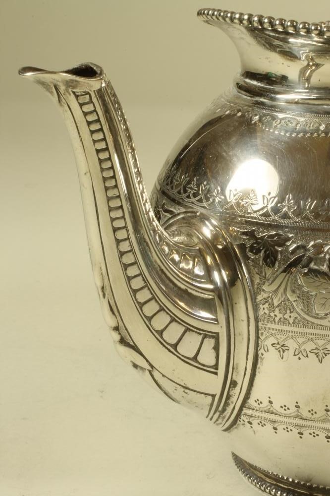 A VICTORIAN SILVER TEAPOT Image