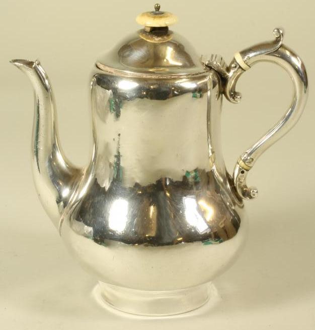 AN EARLY VICTORIAN BRITANNIA STANDARD SILVER HOTWATER JUG Image