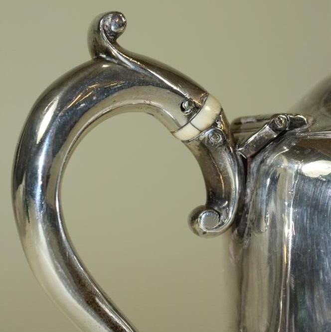 AN EARLY VICTORIAN BRITANNIA STANDARD SILVER HOTWATER JUG Image
