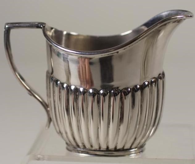 A BACHELOR'S EDWARDIAN SCOTTISH SILVER THREE PIECE TEA SERVICE Image