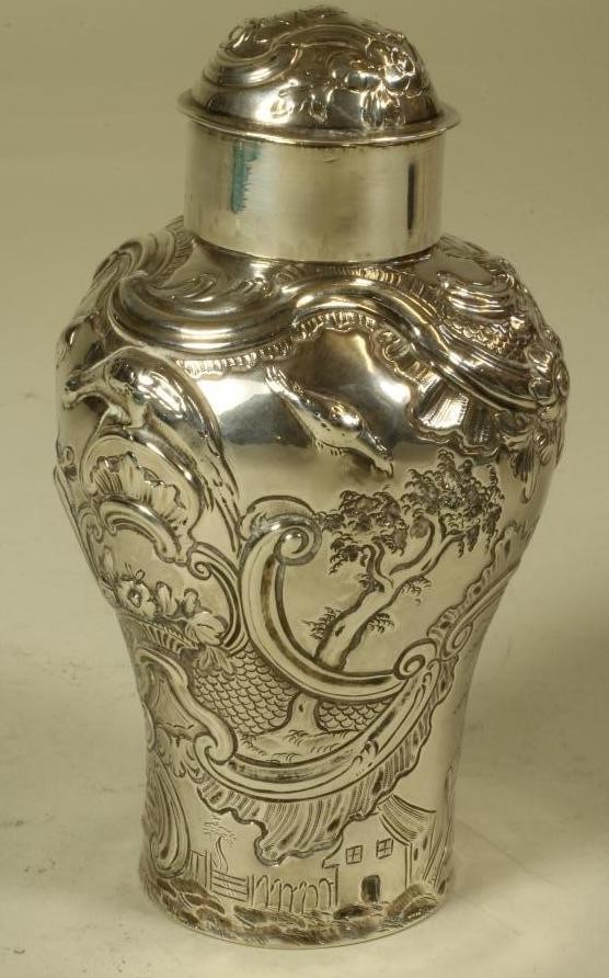 A GEORGE III SILVER TEA CADDY Image