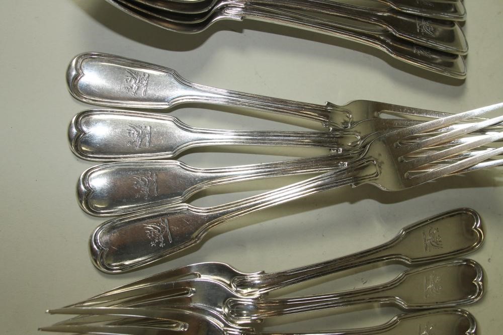 A SET OF ELEVEN WILLIAM IV SILVER DESSERT FORKS Image