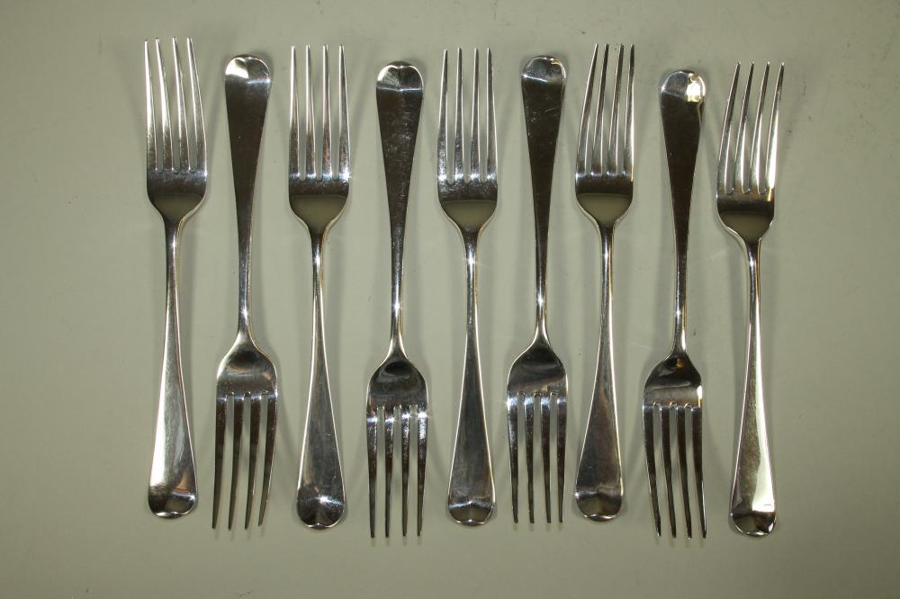 A SET OF NINE GEORGE III SILVER TABLE FORKS Image