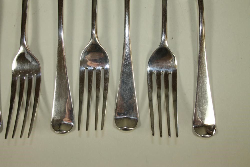 A SET OF NINE GEORGE III SILVER TABLE FORKS Image