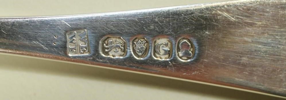 A SET OF NINE GEORGE III SILVER TABLE FORKS Image