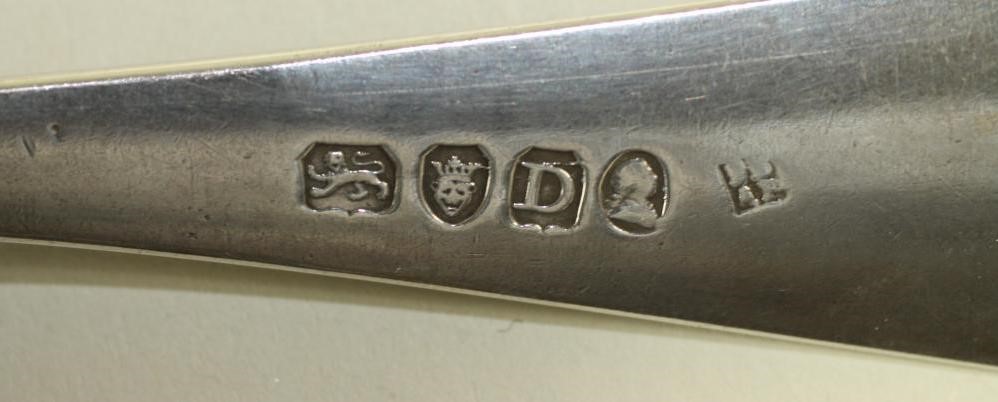 A LATE GEORGE III SILVER TABLESPOON Image