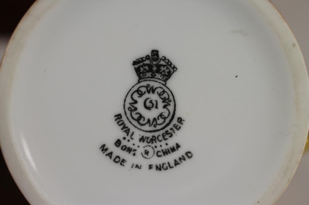 A ROYAL WORCESTER CHINA COFFEE CAN AND SAUCER Image