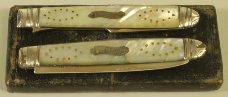 A LATE GEORGE III SILVER FOLDING FRUIT KNIFE AND FORK Image