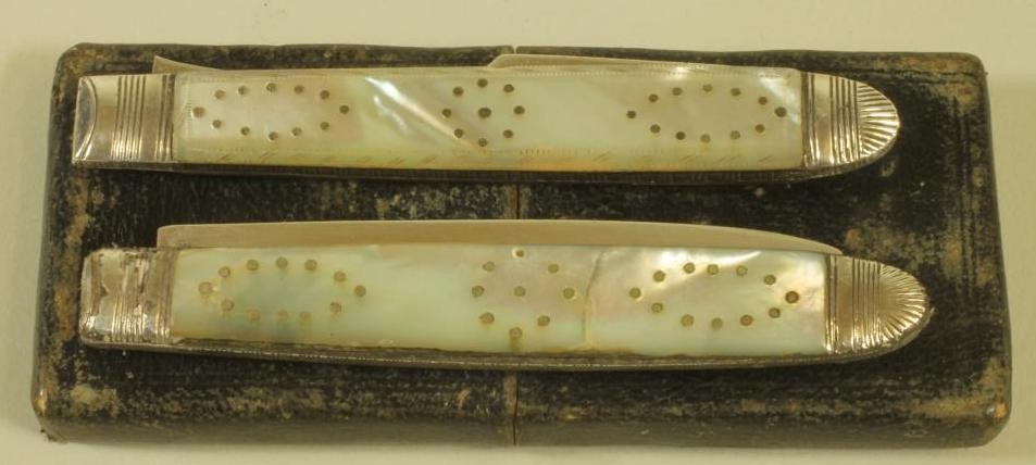 A LATE GEORGE III SILVER FOLDING FRUIT KNIFE AND FORK Image