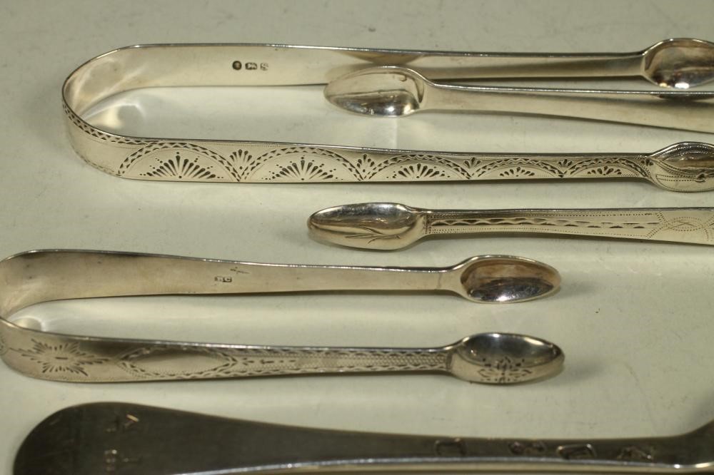 A PAIR OF LATE GEORGE I SILVER TABLESPOONS Image