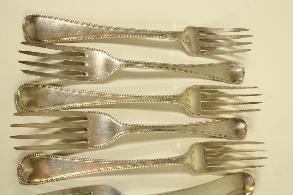 A PAIR OF LATE GEORGE III SCOTTISH SILVER TABLE FORKS Image