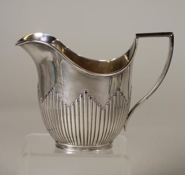 A COMPOSITE EDWARDIAN SILVER THREE PIECE TEA SERVICE Image