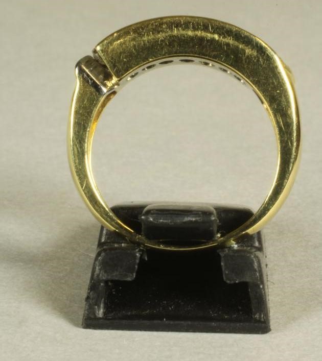 A DIAMOND HALF HOOP ETERNITY RING Image