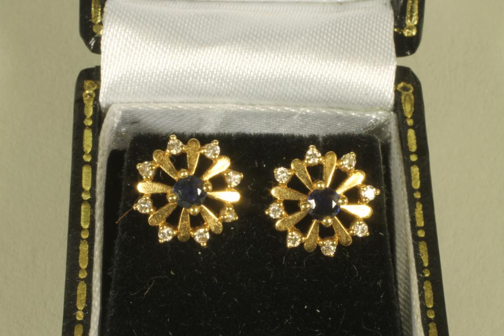 A PAIR OF SAPPHIRE AND DIAMOND SET SNOWFLAKE EAR STUDS Image