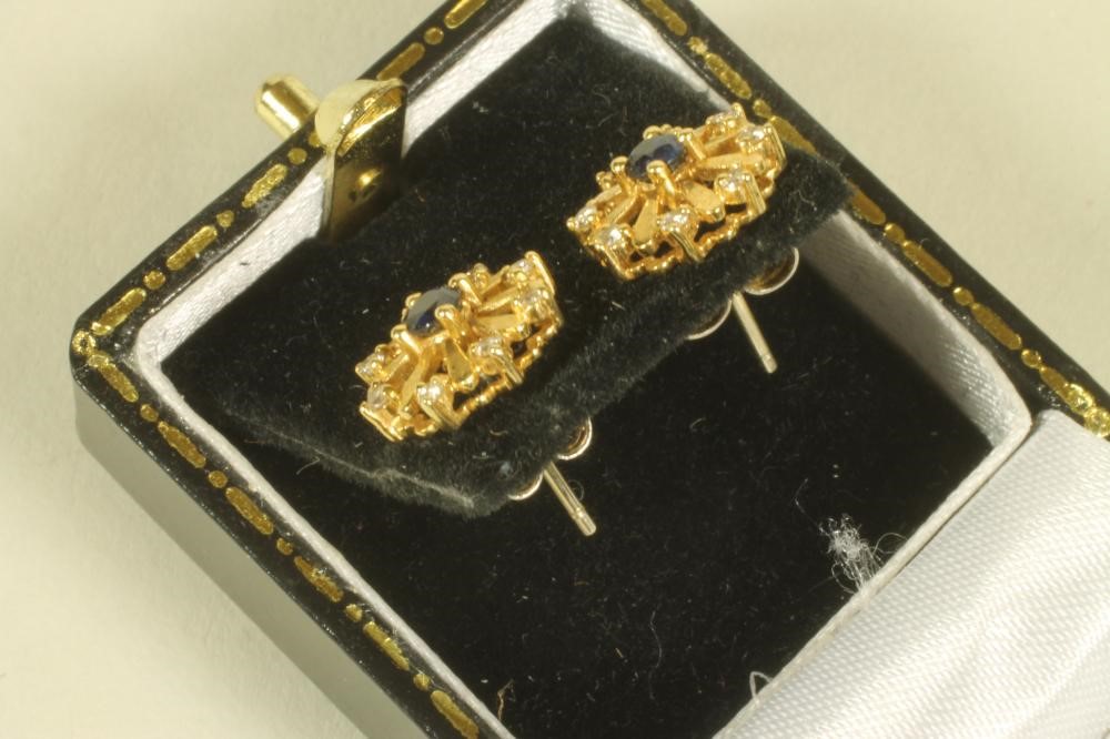 A PAIR OF SAPPHIRE AND DIAMOND SET SNOWFLAKE EAR STUDS Image