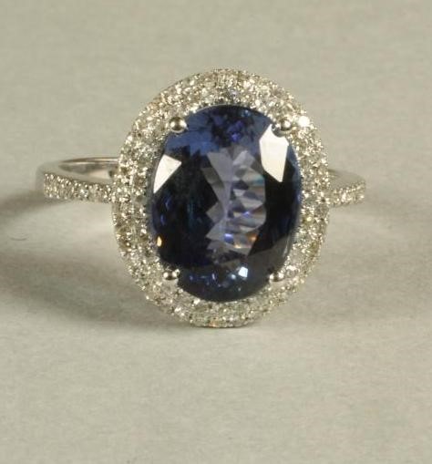 A TANZANITE AND DIAMOND CLUSTER RING Image