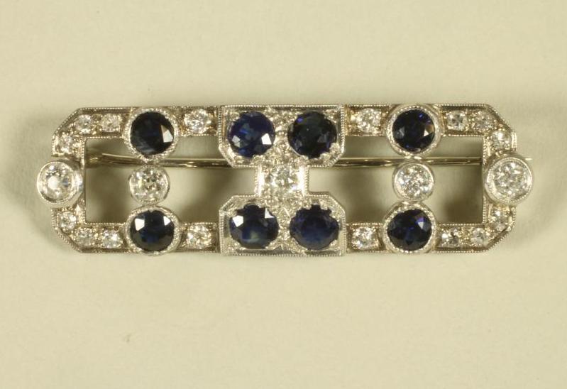 AN ART DECO SAPPHIRE AND DIAMOND BROOCH of oblong form Image
